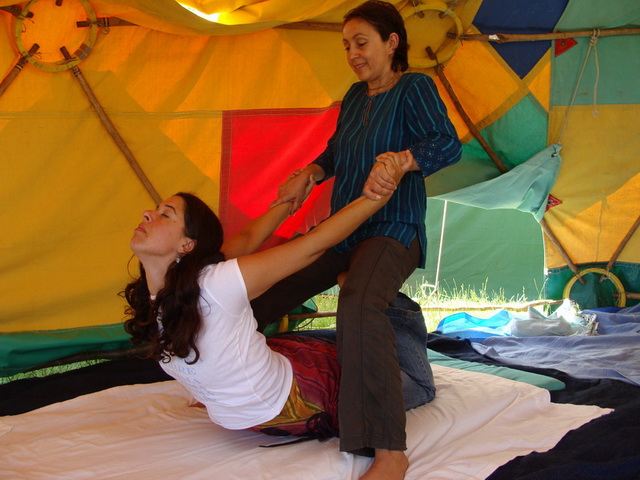 Various holistic healing techniques are practised by the devotees - here Thai Massage is demonstrated.